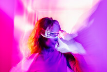 Young Woman With Led Glasses Eyes In Studio