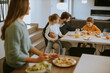 © BGStock72 - Young mother preparing breakfast for her family in the kitchen