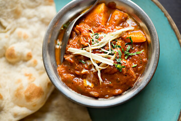 Wall Mural - Masala paneer cheese curry with indian flatbread