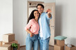 © Prostock-studio - Happy couple showing keys from flat on moving day