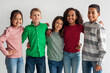 © Prostock-studio - Cheerful Multicultural Preteen Kids Standing Posing Together Over Gray Background