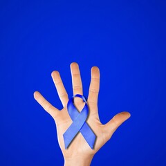 Sticker - Blue ribbon cancer. Awareness prostate cancer of men health in November. Ribbon in hands