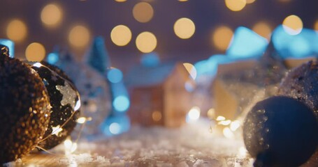 christmas background with bright christmas tree toys, beautiful bokeh, a toy house and candles. chri