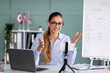 © Prostock-studio - Online education, social distancing, protect from COVID-19 viruses. Happy English teacher recording vlog