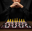 © Narayan - latin man with beard challenging in chess game, chess concept
