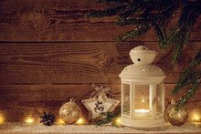 Christmas Background With A White Lantern And Toys. Christmas Evening Wooden Background