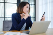 © Cavan Images - Young entrepreneur businesswoman working in modern office