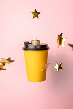 Christmas Bauble Decoration Of Coffee Cup On Pink With Stars.
