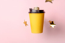 Christmas Bauble Decoration Of Coffe Cup On Pink With Stars.