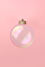 Christmas Bauble Decoration Of Soap Bubble On Pink. New Year Concept.
