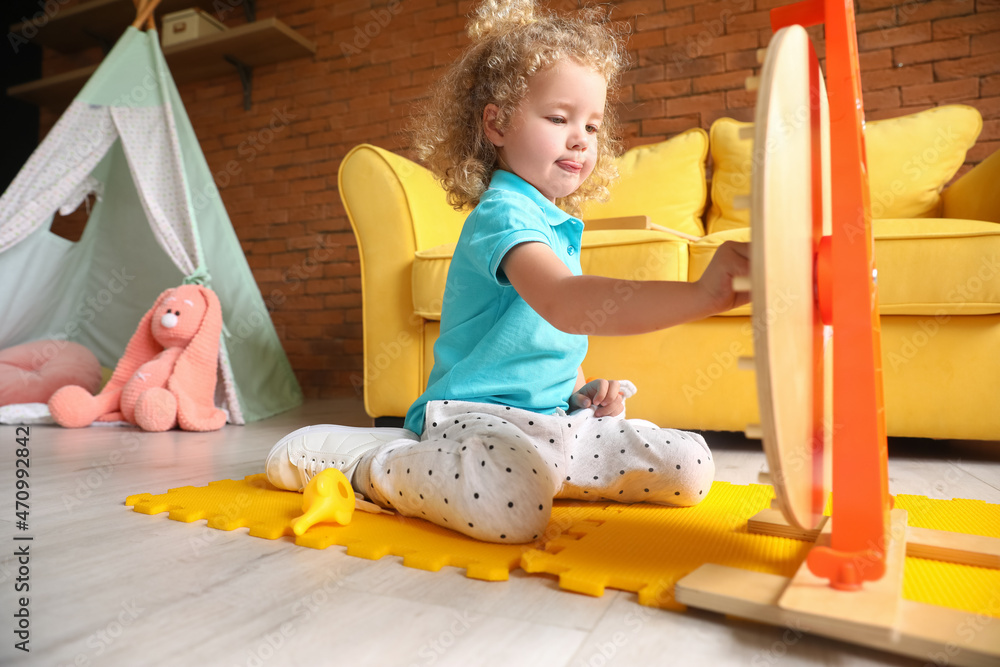 Cute baby girl playing at home