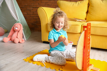 Sticker - Cute baby girl playing at home