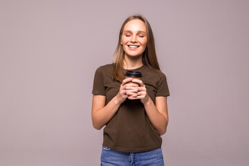 Wall Mural - beautiful young woman with cup of coffee on white