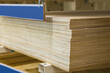 Sheets of thick plywood in a stack in a hardware store. Natural wood material for domestic and industrial production.