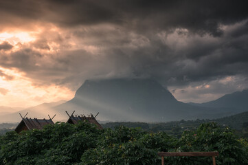 Poster - View of Doi Luang Chiang Dao mountain with sunbeam shine and clouds covered in the evening