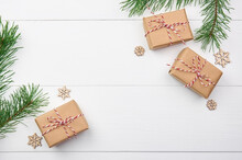Christmas Gift Boxes With Pine Tree Branches On White