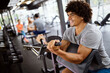 © NDABCREATIVITY - Portrait of fit man working out in gym. Sport people healthy lifestyle exercise concept