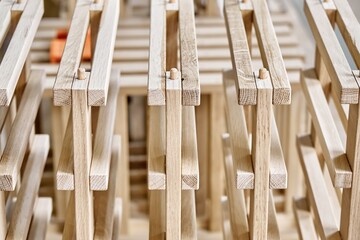 Wine rack made of solid oak and plywood during production in the workshop extreme closeup