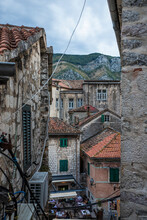 View Of Ancient Buildings In Kotor Town At Sunset, Montenegro.