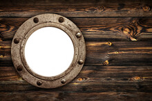 Close-up Of An Old Rusty Closed Empty Porthole Window. Old Rich Wood Grain Texture Background With Knots.