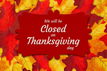 Wall Mural - Closed Thanksgiving Day sign with autumn leaves