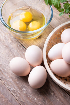 Fototapete - Eggs on wooden table. Brown eggs 