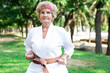 © caftor - Grandmother doing gymnastic exercises in kimono in summer park