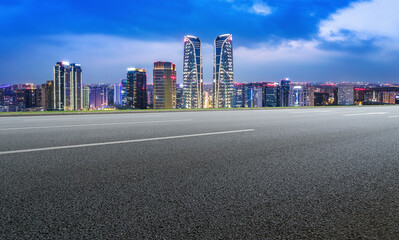 Wall Mural - Empty asphalt road and city skyline and building landscape, China.