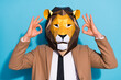 © deagreez - Portrait of unusual anonym guy in lion mask show okey symbol select weird bizarre festive sale isolated over blue color background