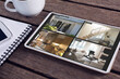 Tablet with views of home from security cameras on screen lying on wooden table