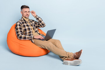 Full length profile side photo of handsome man manager use laptop eyewear isolated over grey color background