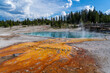 Sapphire hot spring with orange runoff in Yellowstone National Park - West Thumb Geyser Basin