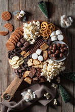 Delicious Different Chocolate Sweets And Popcorn Placed On Table With Ingredients