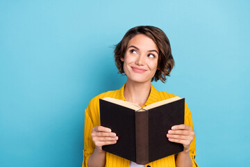 Poster - Photo of dreamy inspired lady read open textbook look empty space wear yellow shirt isolated blue color background