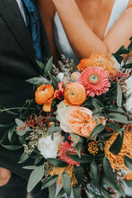 Bride And Groom With Wedding Bouquet Of Flowers 