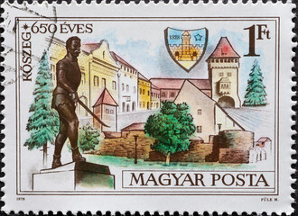 Wall Mural - HUNGARY - CIRCA 1978: A post stamp printed in Hungary showing historical buildings with the statue of Miklós Jurisics, Kőszeg and a coat of arms