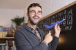 Creative science teacher using toy airplane in classroom