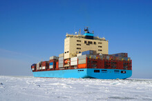 Сontainer Ship Moves Along The Forway In The Ice Of The Gulf Of Finland.