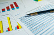 © Leonid - Report summarizes the results of business operations on desk of investor. Financial business statement report