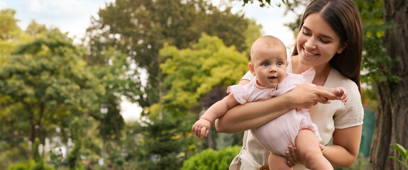 Canvas Print - Happy mother with adorable baby in park on sunny day, space for text. Banner design