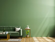 Livingroom interior green wall mock up with green fabric sofa and wooden floor.