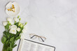 © aradaphotography - Bible with white roses and glasses over the light marble background.