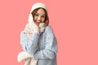 © Pixel-Shot - Young woman in stylish winter clothes on color background