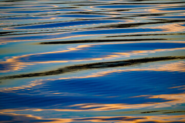 waves on the danube river in the evening light