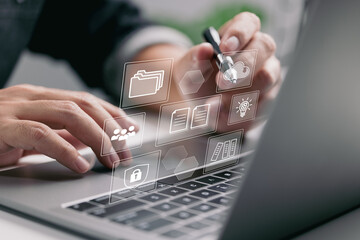 Aufkleber - The concept of enterprise resource planning (ERP) and management documentation. A businessman uses a laptop with simulated digital screen icons to do work.