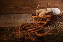 Manger With Baby On Wooden Background. Concept Of Christmas Story