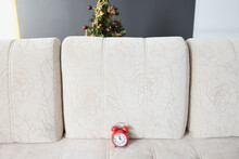 Beige Couch And Red Vintage Clock On It Show Almost Midnight