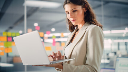 Aufkleber - Young Confident Businesswoman Using Laptop Computer in Modern Office with Colleagues. Stylish Beautiful Manager Working on Commercial, Financial and Marketing Projects. Specialist in Diverse Team.
