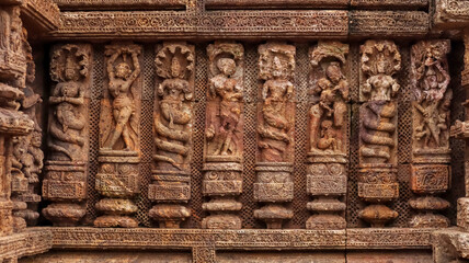 Wall Mural - Temple platform of Jagamohana carved with  erotic couples, young women flaunting their beauty in poses, nagas, vyalas, soldiers, elephants, court scenes Sun Temple Konark, Odisha, India.