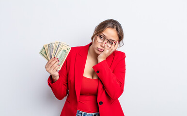 Wall Mural - hispanic pretty woman feeling bored, frustrated and sleepy after a tiresome. business and banknotes concept